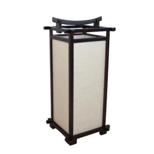 Asian-inspired floor lamp with beige shade and dark frame.